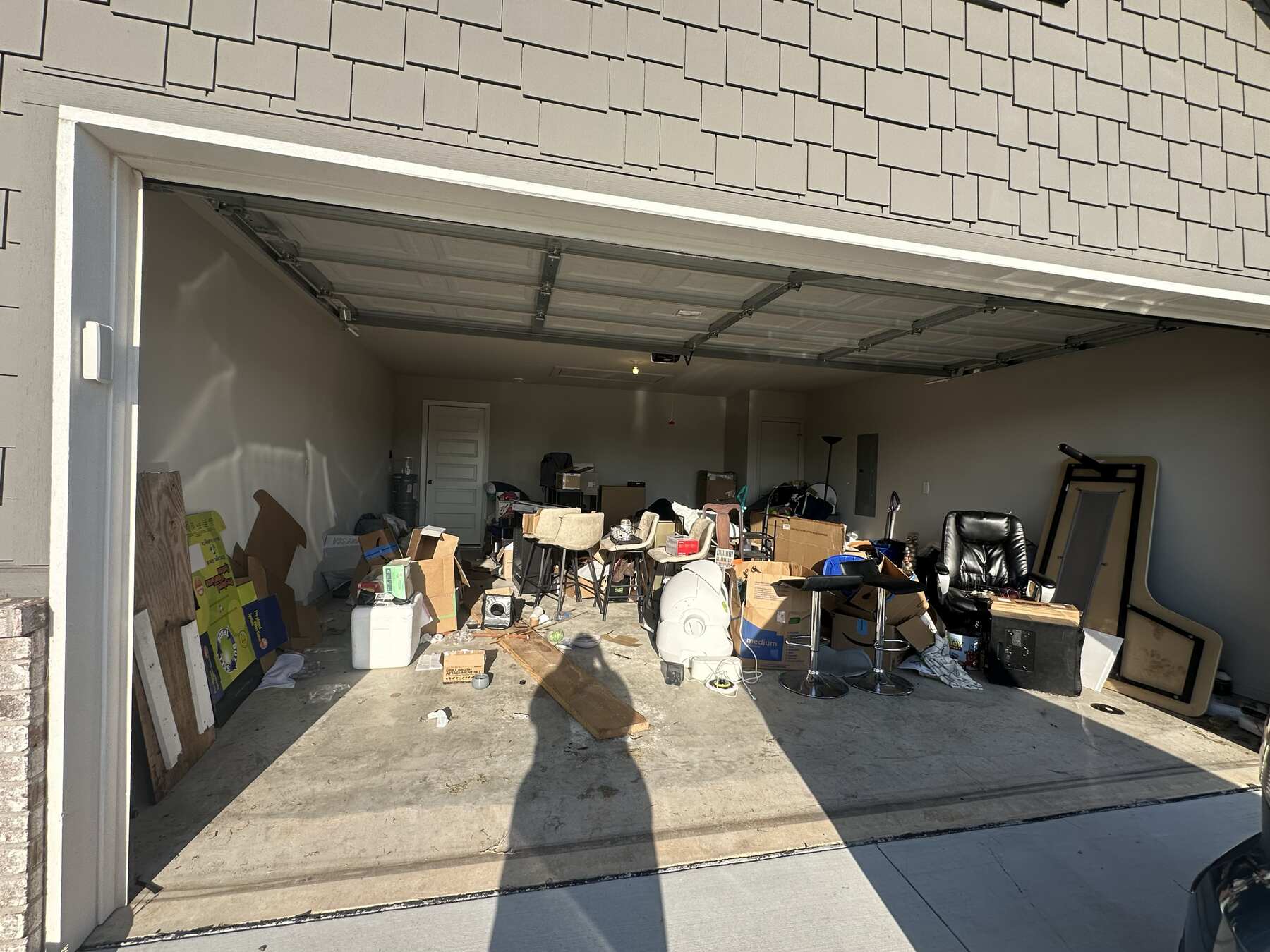 Garage full of junk before JunkLimo cleanout